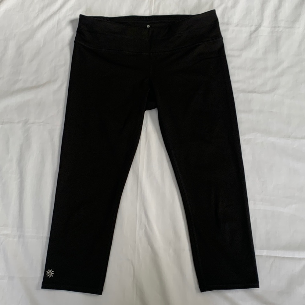 Athleta, size M black capri leggings. Back waistband zipper, great condition.